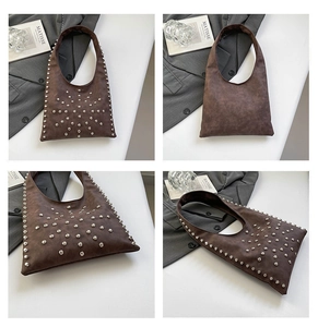 Detailed macro view of vintage brown matte shoulder bag with metallic stud embellishments