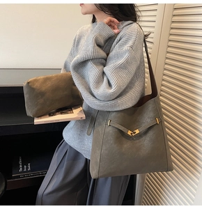 Grey large capacity tote bag with decorative metal buckle and matching zipper pouch