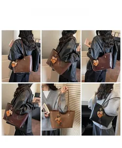Detailed close-up showing four vintage oil wax leather tote bags with cute bear pendants