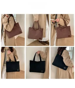 Detail of brown and black corduroy tote bags with soft texture for daily commuting use
