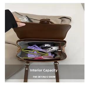 Detail view of large capacity vintage brown leather tote interior with zipper pocket