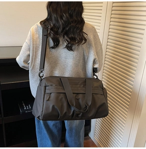 Deep grey large capacity nylon travel bag with adjustable strap and front pocket