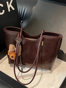 Retro wax leather tote bag with a cute bear charm for daily commute and office use