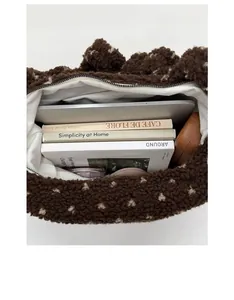 Internal view of brown plush polka dot tote bag showing large capacity for laptop and books