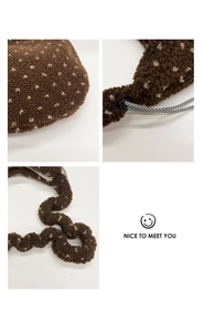 Detail of brown fuzzy fleece tote bag with beige dots and drawstring closure cord