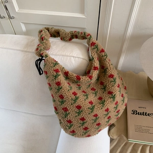 Detail of floral sherpa tote bag showing soft lamb wool texture and ruffled shoulder strap
