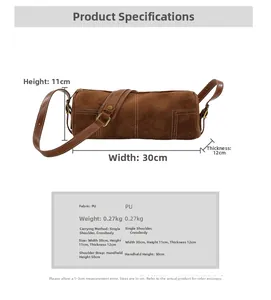 Detail of frosted brown barrel bag with white stitching and size specifications