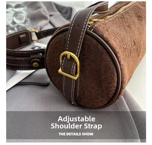 Detail showing adjustable shoulder strap and vintage gold buckle on leopard print bag
