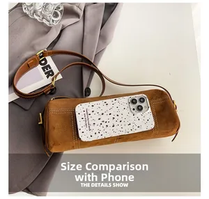 Brown suede cylinder bag size comparison showing internal capacity with a smartphone