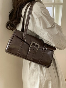 Retro dark brown rectangular shoulder bag with large metal buckle on matte faux leather