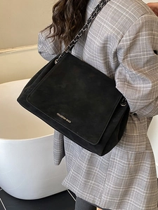 Vintage black matte shoulder bag with silver chain strap and gold logo lettering