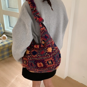 Detail of bohemian geometric pattern on thick sherpa fleece tote bag with wide strap