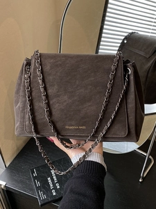 Vintage dark brown tote bag in matte leather with a chain strap and flap design