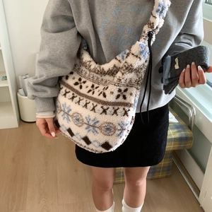 Detail of fluffy Fair Isle hobo bag with Nordic patterns and adjustable drawstring cord