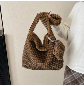 Detail of caramel plush tote set showing textured faux fur and matching mini bag pouch