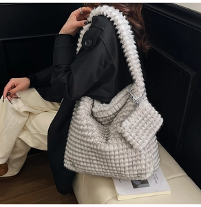 Macro detail of plush grey faux fur tote bag with checkered texture and matching pouch