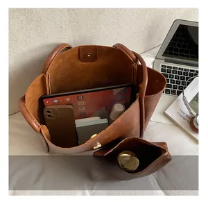 Top view of brown retro leather tote bag set showing spacious interior and daily essentials