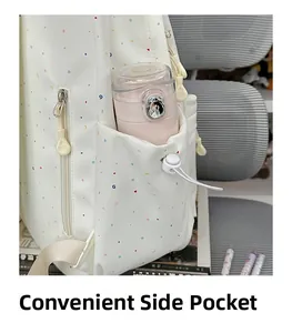 Detail of a beige backpack side pocket with colorful print holding a water bottle