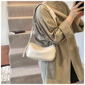 Detail of off-white glossy Boston bag with brand plaque and jacquard shoulder strap
