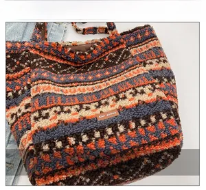 Close-up of ethnic patterned lamb wool tote bag with Star-picking leather brand label