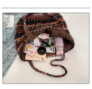 Spacious tote bag interior showing ample capacity with personal items and ethnic patterns
