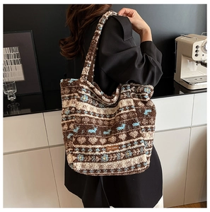 Close-up of contrast stripe faux fur tote bag with Star Picking label and floral patterns