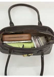 Top view of dark brown tote bag showing spacious interior with daily essentials