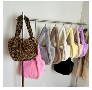 Detailed display of plush leopard print tote bags in nine colors hanging on a metal rod
