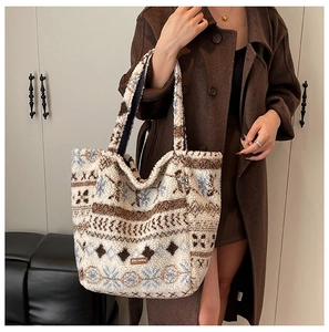 Detailed view of winter tote bag with geometric snowflake patterns and fleece texture