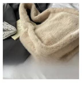 Close-up of beige faux fur tote bag showing soft plush texture and fluffy shoulder strap