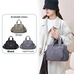 Detail view of khaki black and light purple nylon waterproof multi-pocket handbags