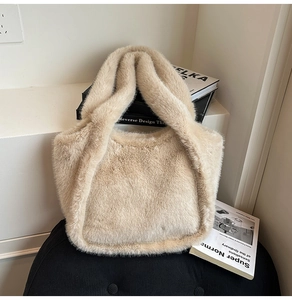 Detailed texture of plush leopard print faux fur on a large beige tote bag surface