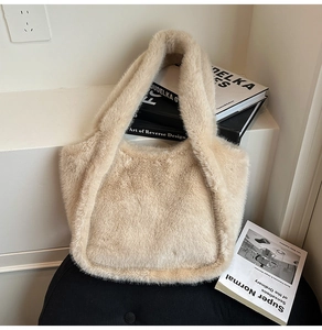 Close-up of fluffy cream faux fur tote bag showing soft plush texture and seamless handle