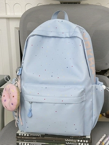 Light blue school backpack with colorful dots and donut plush charm for students