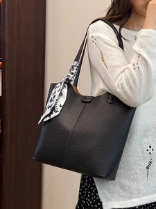 Chic black litchi leather tote bag with decorative scarf for women's daily commute style