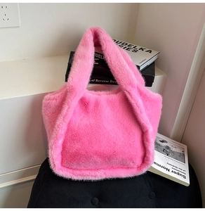 Close-up of bright pink faux fur tote bag with soft texture and integrated handle