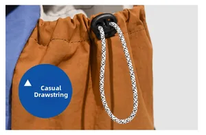 Macro detail of the casual drawstring on the orange lightweight hiking backpack