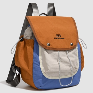 Close-up of color-block hiking backpack with waterproof nylon and metal buckle closure