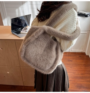 Macro shot of fluffy brown faux fur texture on a large capacity plush shoulder tote bag