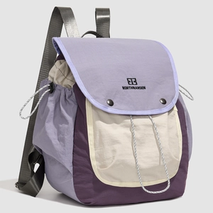 Detail showing the waterproof nylon fabric and the stylish purple color-block design