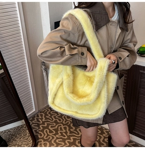 Close-up of fluffy leopard print plush tote bag showing the soft faux fur texture