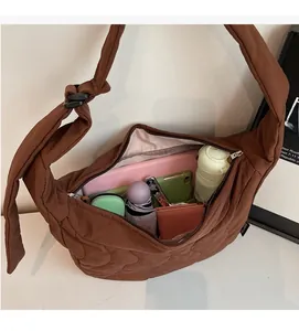 Interior view of large quilted crossbody bag showing spacious storage for daily essentials