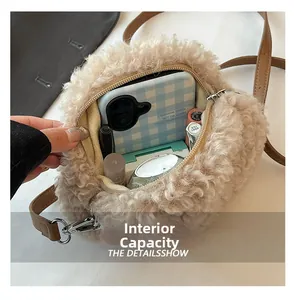 Detail view of round sherpa crossbody bag showing spacious interior with daily essentials