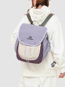 Ultralight color-block hiking backpack with purple flap and durable green straps for travel