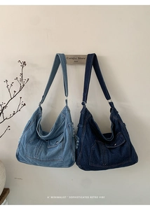 Detail of two vintage-style denim tote bags showing washed textures and frayed edges