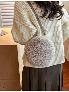 Furry round shoulder bag in beige faux lamb wool with a dark brown leather strap
