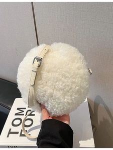 White faux fur round crossbody bag with adjustable cream leather strap and silver zipper
