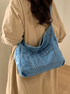 Large blue denim crossbody shoulder bag with vintage fringed detail for women