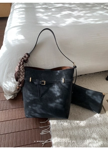 Detail of black faux leather tote bag with printed silk scarf and inner pouch