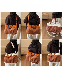 Detail of color-block travel bag showing mesh texture and detachable shoulder strap options